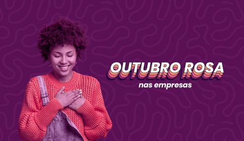 Mulher de cabelo cacheado e pele negra colocando a mão sobre o peito. Ela veste uma roupa laranja por baixo de um macacão. Do lado direito dela, está escrito 'Outubro Rosa nas empresas'.